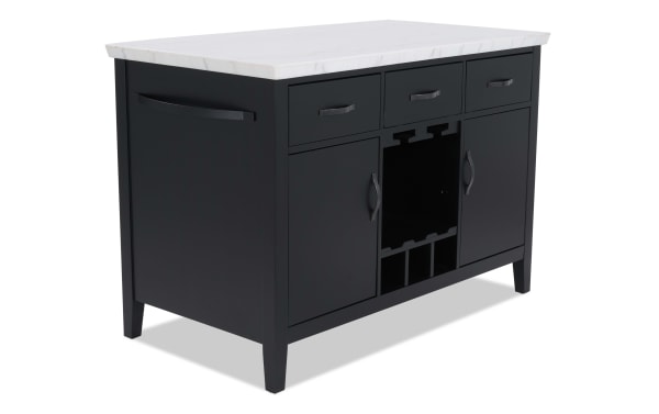 Black kitchen island with white marble countertop, featuring three drawers, two cabinets, and a central wine rack for storage and organization.