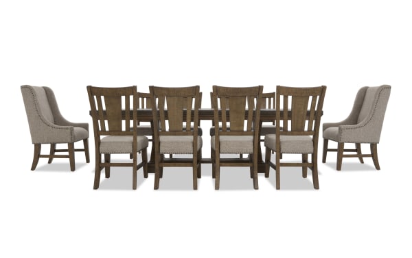 Dining set with eight wooden chairs featuring beige upholstered seats and backs, and a matching rectangular wooden table, ideal for formal dining rooms.