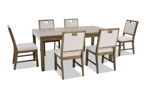 Dining set with a rectangular wooden table and six cushioned chairs featuring beige fabric upholstery and wooden frames, modern rustic style.