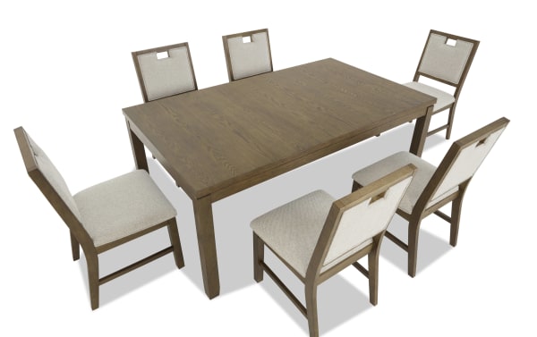 Rectangular wooden dining table with six beige upholstered chairs, featuring a modern design with clean lines and a natural wood finish.