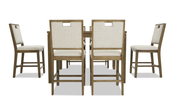 Wooden dining set with six beige upholstered chairs featuring cushioned seats and backrests, sturdy frames, and a rectangular table, ideal for modern dining rooms.