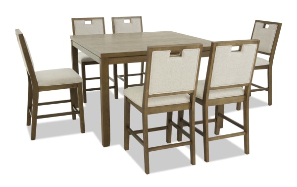 Dining set with a rectangular wooden table and six beige upholstered chairs featuring wooden frames and cutout backrests, ideal for modern kitchens or dining rooms.
