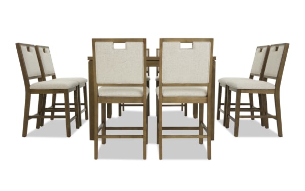 Dining set with eight wooden chairs featuring beige upholstered seats and backs, arranged around a rectangular wooden table.