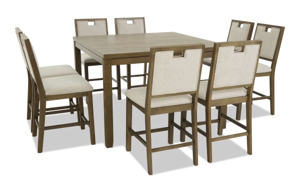 Wooden dining table set with eight beige upholstered chairs, featuring a light brown finish and square table design, suitable for modern dining rooms.