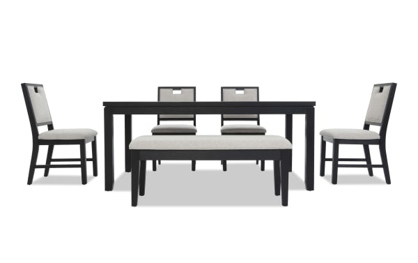 Dining set with a black wood rectangular table, four chairs with light gray cushioned seats and backs, and a matching cushioned bench.