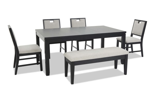 Dining set with a black wood rectangular table, four matching chairs with beige upholstered seats and backs, and a beige cushioned bench.