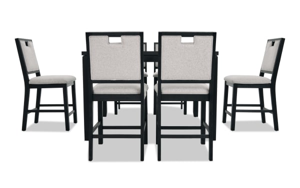 Dining set with six black wooden chairs featuring light gray upholstered seats and backs, modern design with cut-out handle detail.