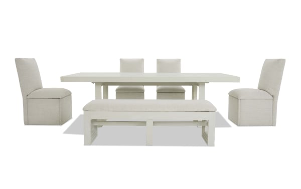 Dining set with a white rectangular extendable table, two beige upholstered side chairs, two matching chairs at the back, and a cushioned bench with white wooden legs.