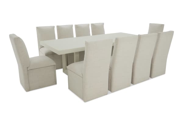 Modern beige fabric dining table set with a rectangular white tabletop and ten high-back upholstered chairs, suitable for large dining spaces.