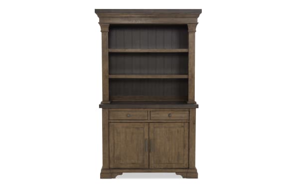 Rustic brown wooden hutch with two open shelves, two drawers, and a two-door cabinet, featuring metal handles and a plank back panel.