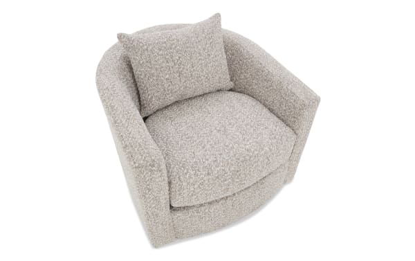 Beige textured fabric swivel armchair with rounded back and matching square cushion, modern cozy living room seating.