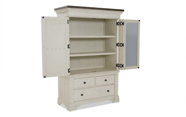 White wooden storage cabinet with two open doors revealing two interior shelves, three black knobs on four drawers, and a dark wood top.
