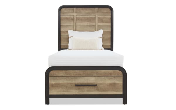 Twin bed with rustic wood panel headboard and footboard, black metal frame, white mattress, and decorative white pillows.