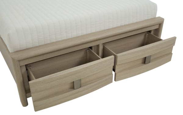 Wooden bed frame with light oak finish featuring two spacious under-bed storage drawers with metal handles, ideal for bedroom organization.