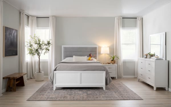 Transitional Trinity Bedroom set with white rubberwood 6-drawer dresser and beveled mirror, featuring smooth-glide dovetail drawers and felt-lined top drawers.