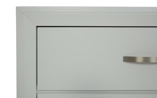 Close-up of the Trinity White 6 Drawer Chesser in transitional style, made of durable white rubberwood with smooth-gliding drawers and a sleek metal handle.
