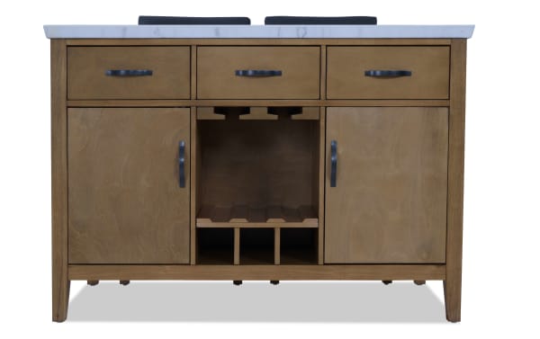 Wooden bathroom vanity with a white marble countertop, three drawers, two cabinet doors, and a central wine rack with black metal handles.