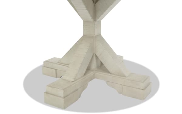 Whitewashed wooden table base with a sturdy, cross-shaped design and angled support beams, showcasing rustic farmhouse style.