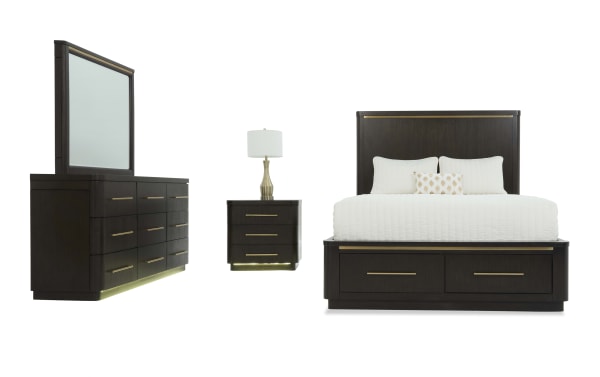 Dark wood bedroom set with a king-size bed featuring storage drawers, a dresser with mirror, and a nightstand with a lamp, all with gold-tone handles and modern design.