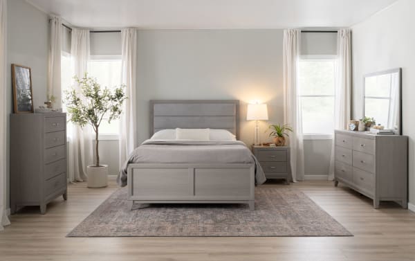 Transitional Trinity 5 Piece Queen Gray Upholstered Panel Bedroom Set with rubberwood frame, polyester fabric headboard, smooth-gliding drawers, felt-lined top drawers, USB/USB-C ports, and beveled mirror dresser.