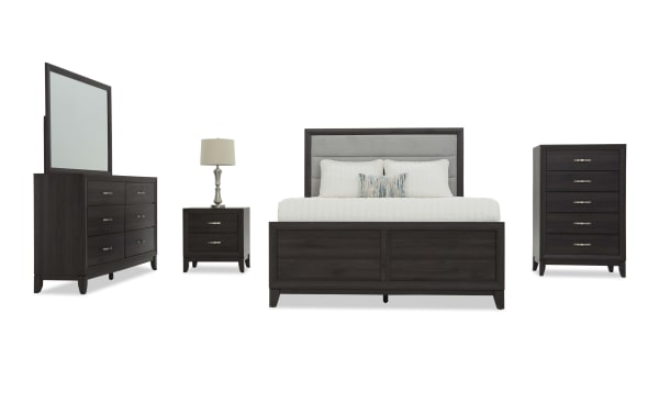 Dark wood bedroom set featuring a queen bed with upholstered headboard, six-drawer dresser with mirror, two-drawer nightstand with lamp, and five-drawer chest.