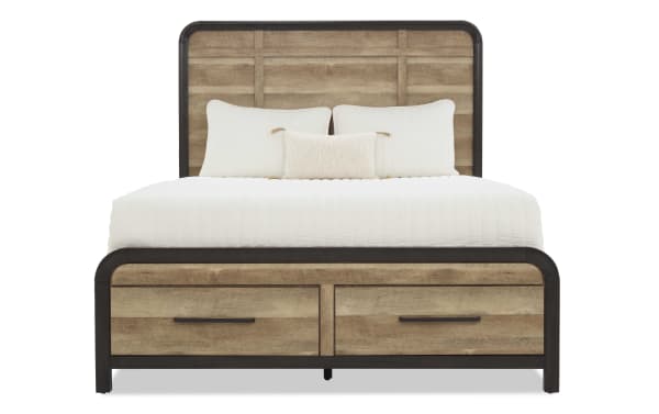 Queen-size bed with rustic wood panel headboard and footboard, black metal frame accents, and two storage drawers, styled with white bedding and pillows.