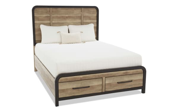 Queen-size bed frame with light brown wood panels, black metal trim, two front storage drawers, and white bedding with pillows.