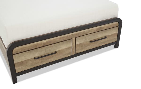 Wooden bed frame with built-in storage drawers in rustic finish, featuring black metal handles and trim, designed for space-saving bedroom organization.