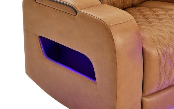 Tan leather recliner armrest with diamond-stitched upholstery and built-in side speaker, featuring a blue LED light accent.