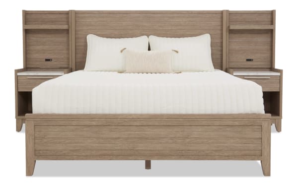 King-size wooden bed frame with integrated nightstands, light oak finish, white bedding, and modern minimalist design.