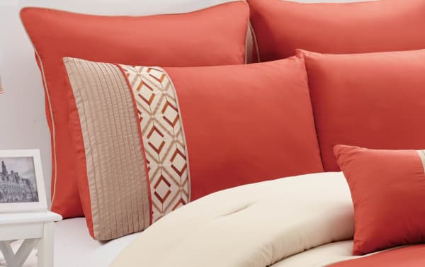 Marcella Queen 7 Piece Comforter Set in vibrant orange and white polyester fabric with gold geometric accents, transitional style bedding with decorative pillows
