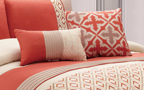 Marcella Queen 7 Piece Comforter Set in orange, white, and gold polyester fabric with geometric patterns and decorative pillows, transitional style.