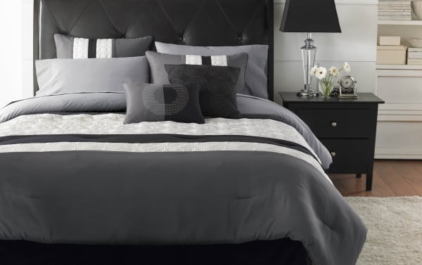 Briggs Queen Black Medallions 9 Piece Comforter Set in gray, white, and black polyester fabric with decorative pillows, transitional style, and black tufted headboard.