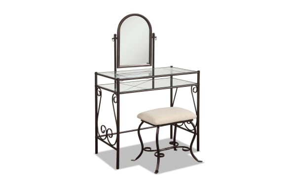 Levi Bronze Vanity Set with beige polyester cushioned stool, transitional style steel frame, glass top and shelf, and arched mirror for elegant dressing.