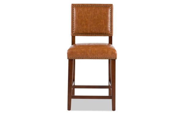 Marie Camel faux leather upholstered counter height stool with nailhead trim, rubberwood frame, and contemporary brown finish for casual dining.