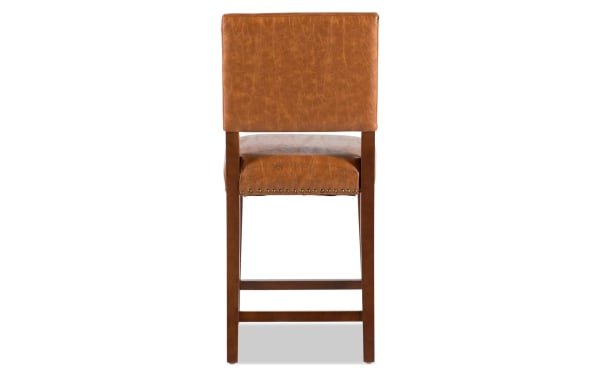 Marie Camel faux leather upholstered counter height stool with camel polyurethane seat, nailhead trim, and sturdy rubberwood frame in contemporary style.