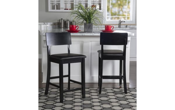 Contemporary dark brown faux leather panel back counter height stool with padded polyurethane seat, rubberwood frame, and clean lines for kitchen or bar use.