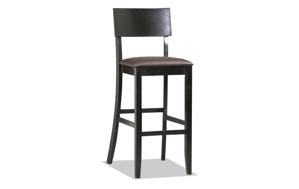 Contemporary dark brown faux leather panel back bar stool with padded vinyl seat, rubberwood frame, and clean lines for kitchen or bar seating.
