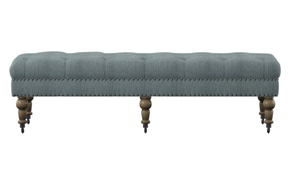 Delfina Washed Blue 62'' bench with button-tufted washed blue linen upholstery, brushed silver nailhead trim, and traditional turned rubberwood legs.