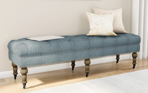 Delfina Washed Blue 62'' bench with traditional button tufting, brushed silver nailhead trim, blue linen fabric, and turned wood legs.