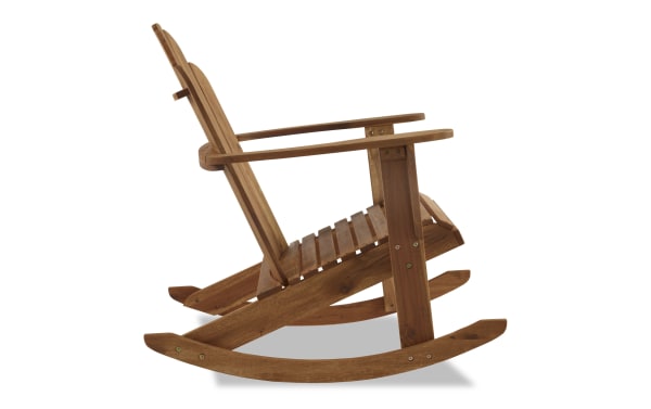 Traditional Joan Brown solid Acacia wood outdoor Adirondack rocker chair with high back, side armrests, teak finish, and slatted seat for porch or poolside.