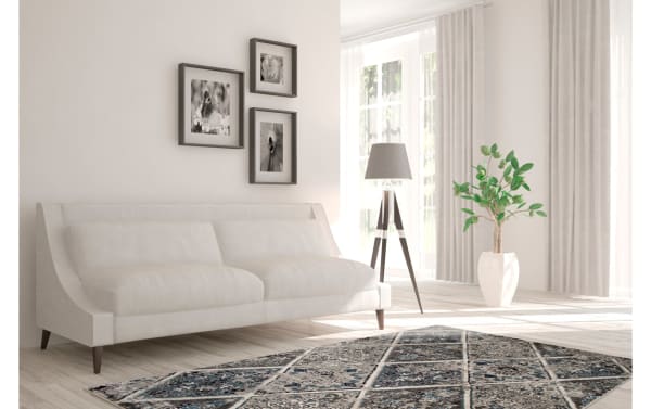 Transitional Casablanca 8' x 10' Gray Vintage Rug in multicolored polypropylene with intricate geometric patterns, paired with a beige sofa and modern decor.