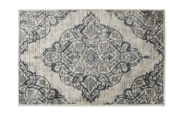 Lilah 5' x 7' Blue Damask Rug with intricate blue damask pattern on a neutral background, made of durable polypropylene and polyester fabric, transitional style.