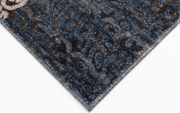 Corner close-up of the Hoboken 8' x 10' Gray Damask Rug showing intricate blue, gray, beige, and black medallion pattern in soft polypropylene fabric with transitional style.