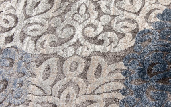 Hoboken 5' x 8' Gray Damask Rug with intricate medallion pattern in muted gray, beige, white, and blue tones, made of durable polyester and polypropylene. Transitional style fabric rug ideal for elegant, balanced room decor.