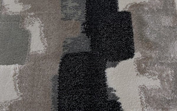Contemporary Chantel 8' x 10' gray abstract area rug in heat set polypropylene with cream, ebony, charcoal, light gray, beige, and birch tones.