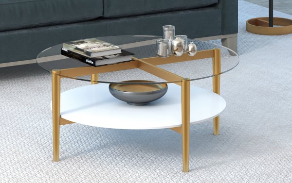 Connor White Round Coffee Table with mid-century modern style, featuring a clear tempered glass top, white lower shelf, and gold hand-crafted steel frame with tapered legs.