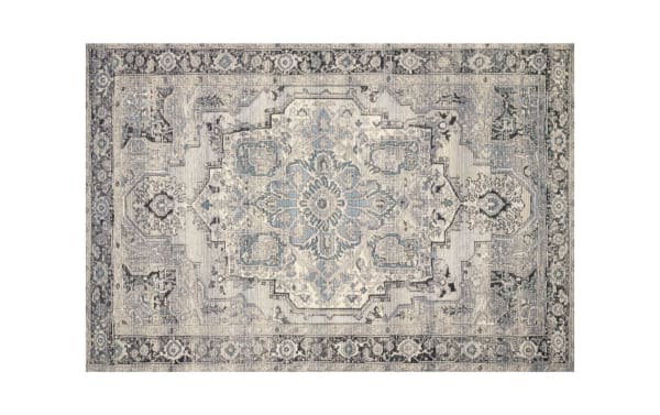 Roy 7' x 10' Gray Oriental Indoor/Outdoor Rug with traditional design in gray, silver, light blue, and charcoal. Made of polypropylene fabric with low-pile, soft texture for versatile indoor or outdoor use.