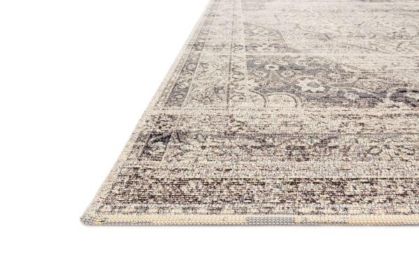 Traditional Wes 2' x 7' Slate Oriental indoor/outdoor runner rug in multicolored slate, ivory, charcoal, and light gray. Made of durable polypropylene fabric with subtle floral motifs and a soft, machine-made texture. Ideal for dining rooms, patios, and versatile indoor/outdoor spaces.