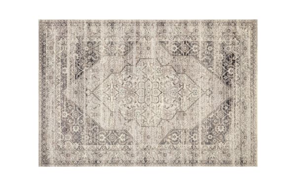 Wes 2' x 4' Slate Oriental Indoor/Outdoor Rug with traditional floral pattern in slate, ivory, charcoal, and light gray. Made of soft, durable polypropylene and polyester fabric, ideal for dining rooms and patios.